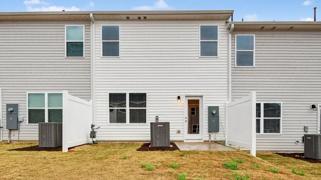 Exterior details and patio area of a home in The Townes at Galvins Ridge, Sanford (Image 3).