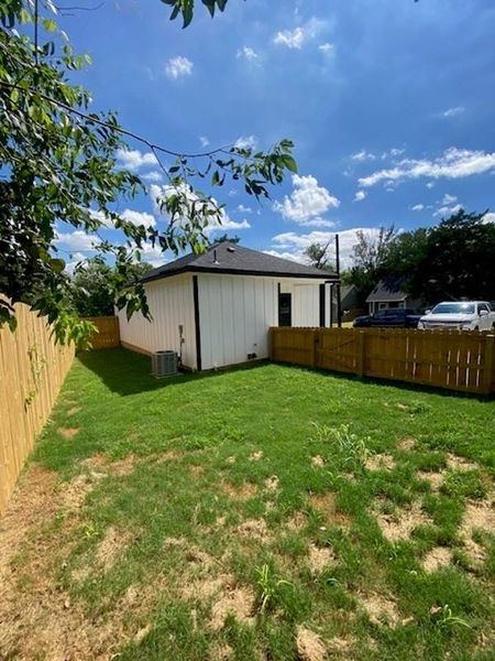 Secure yard featuring privacy fencing and a neatly maintained lawn provides an ideal outdoor space. Secure yard featuring privacy fencing and a neatly maintained lawn provides an ideal outdoor space.