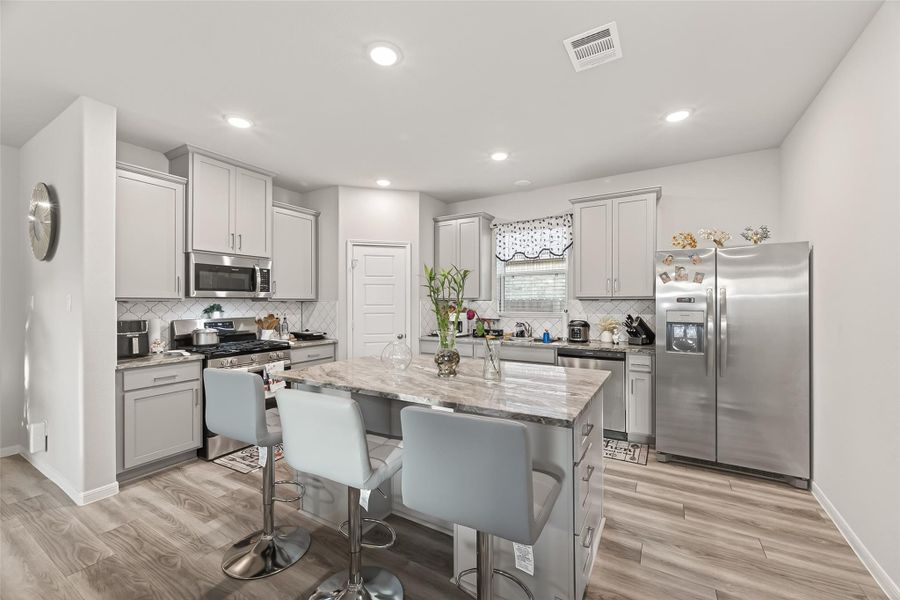 Furnished interior view inside a new home in Sunterra, Katy (Image 34).
