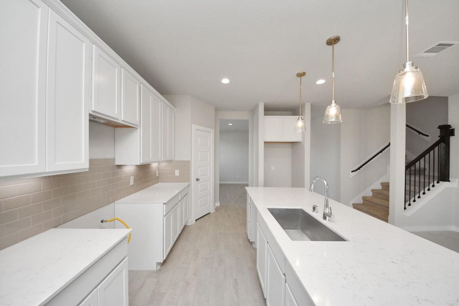 This generously spacious kitchen is a dream realized! Sample photo of completed home with similar floor plan. Actual colors and selections may vary. This generously spacious kitchen is a dream realized! Sample photo of completed home with similar floor plan. Actual colors and selections may vary.