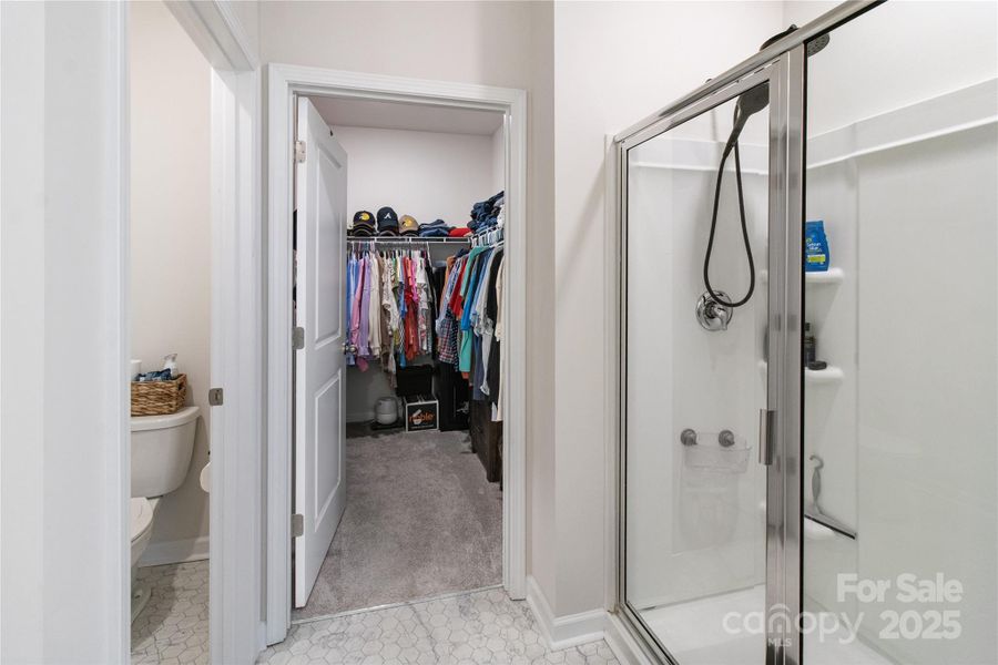 Large walk in closet with access from primary bath Large walk in closet with access from primary bath