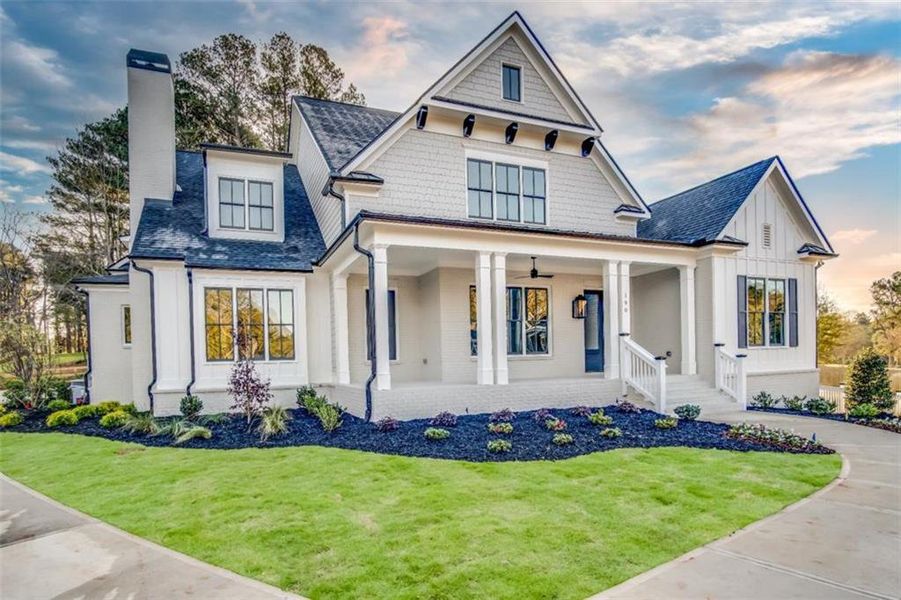Front exterior of a new home in , Woodstock, GA, highlighting curb appeal (Image 2).