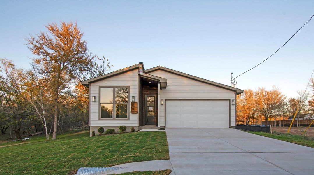 Front exterior of a new home in , Bastrop, TX, highlighting curb appeal (Image 2).