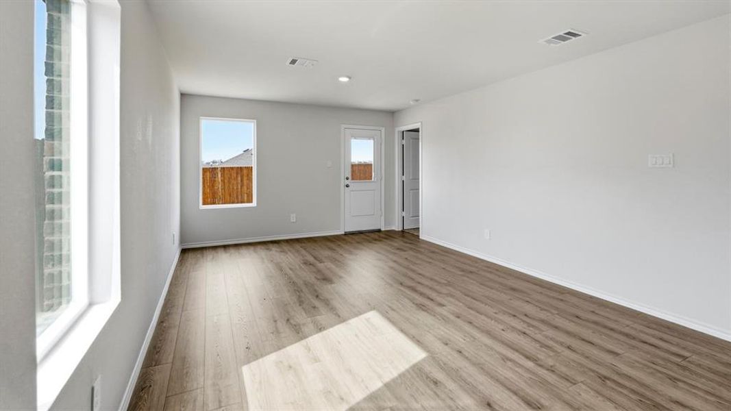 Unfurnished room featuring light wood-style flooring and recessed lighting Unfurnished room featuring light wood-style flooring and recessed lighting