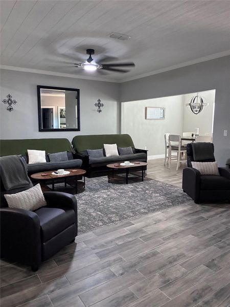 Wooden terrace with ceiling fans Lighting and grill area