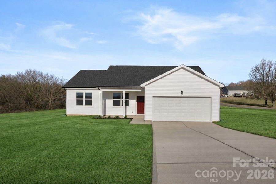 Virtually staged to show how yard will look with grass