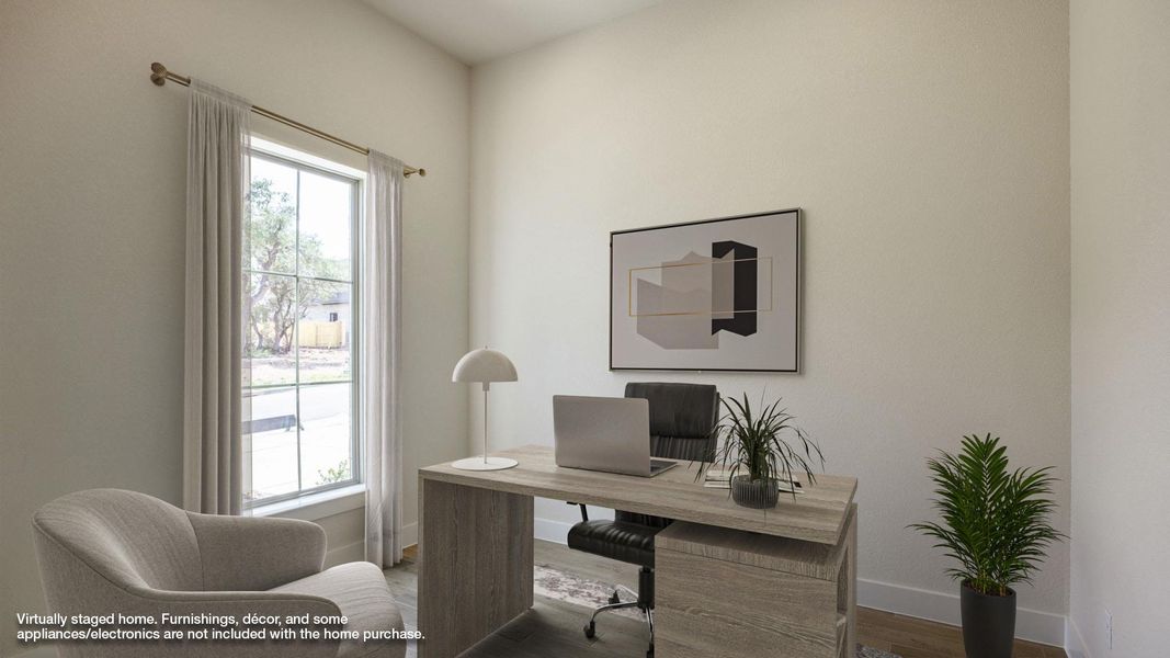 Office space featuring baseboards and wood finished floors Office space featuring baseboards and wood finished floors