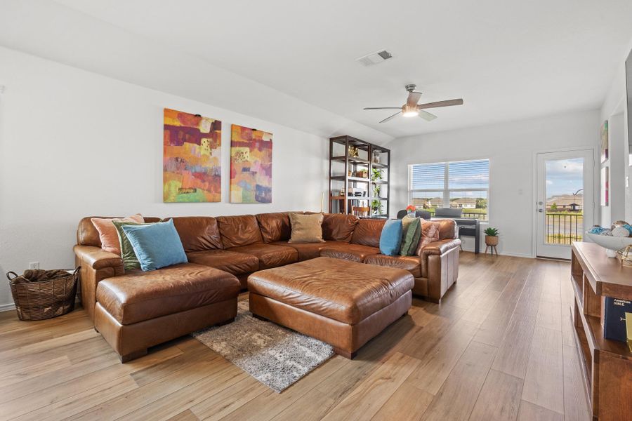 Blended living and dining areas feature light colored flooring and a serene view of greenbelt lake and heritage Live Oaks. Blended living and dining areas feature light colored flooring and a serene view of greenbelt lake and heritage Live Oaks.