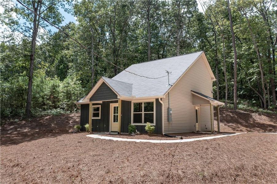 Front exterior of a new home in , Buchanan, GA, highlighting curb appeal (Image 17).
