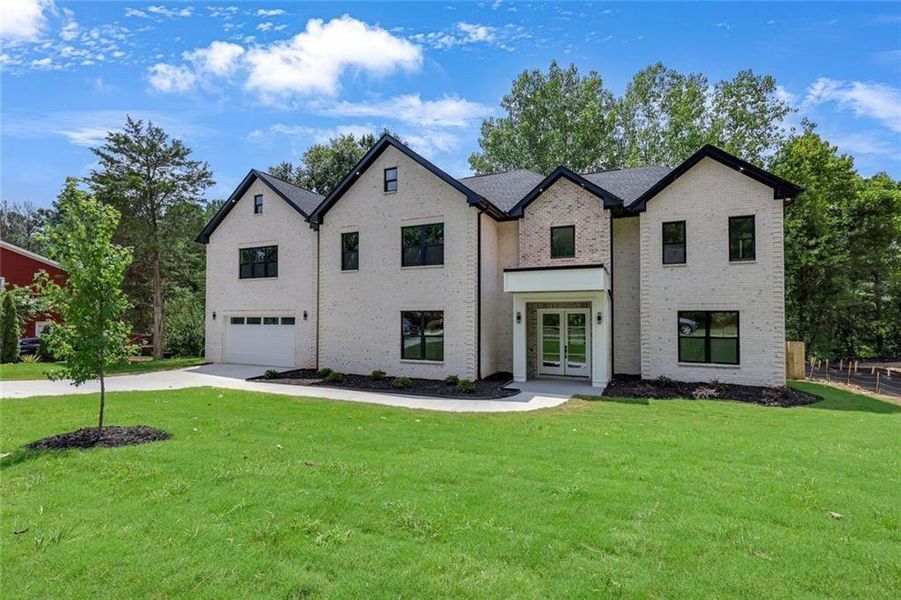 Front exterior of a new home in , Snellville, GA, highlighting curb appeal (Image 32). Front exterior of a new home in , Snellville, GA, highlighting curb appeal (Image 32).