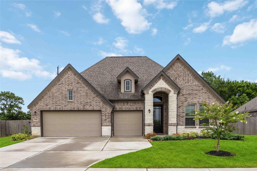 Front exterior of a new home in Lakes of Champion's Estates, Mont Belvieu, TX, highlighting curb appeal (Image 26). Front exterior of a new home in Lakes of Champion's Estates, Mont Belvieu, TX, highlighting curb appeal (Image 26).
