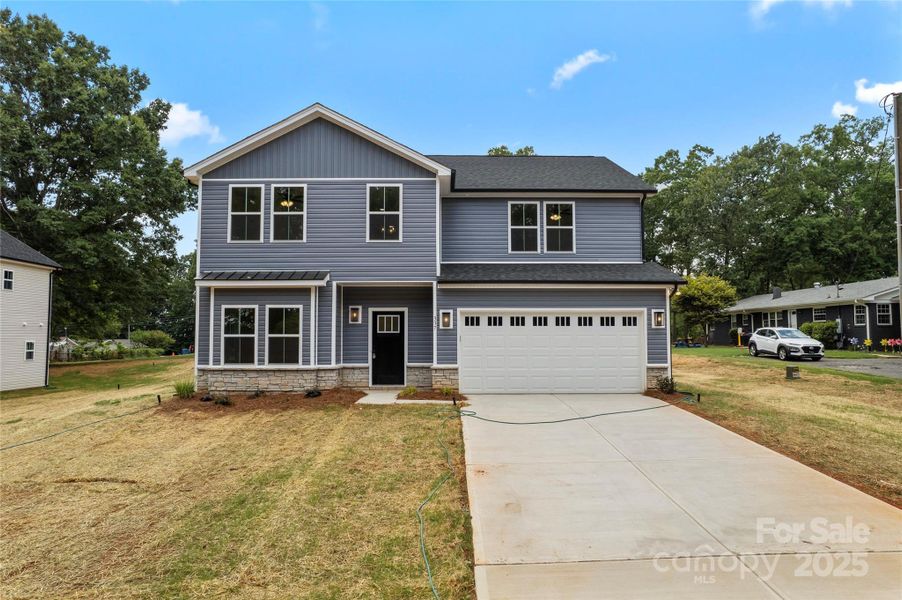 Front exterior of a new home in , Harrisburg, NC, highlighting curb appeal (Image 1). Front exterior of a new home in , Harrisburg, NC, highlighting curb appeal (Image 1).