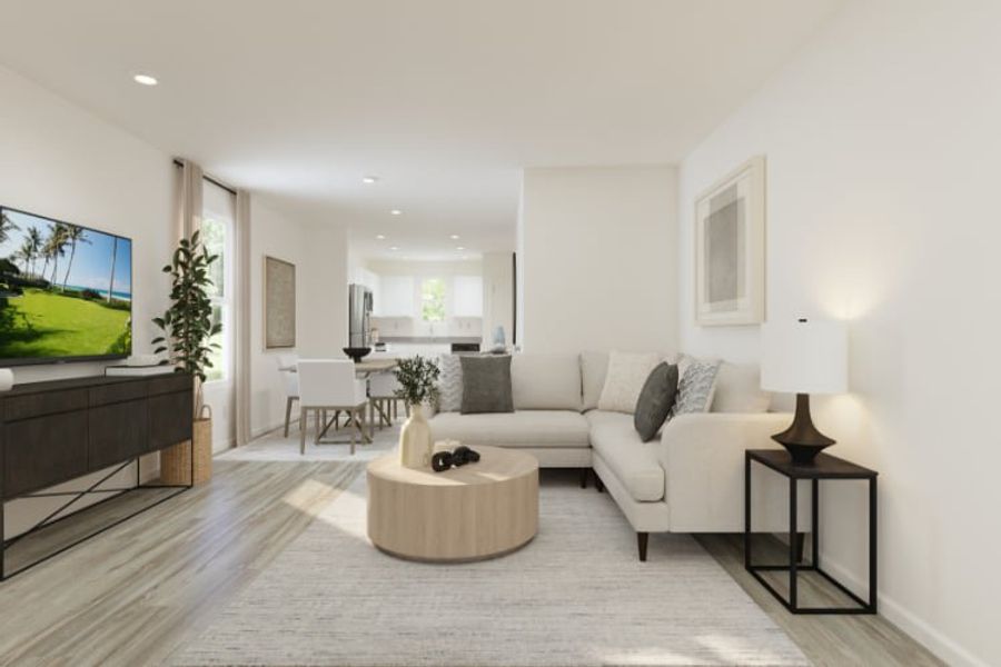 A living room with a large television.