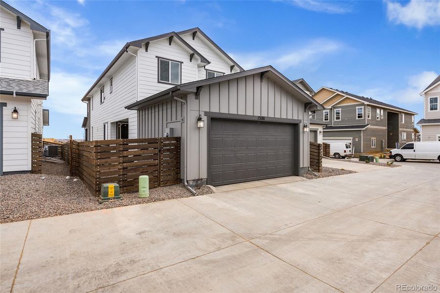 Front exterior of a new home in Barefoot Village, Firestone, CO, highlighting curb appeal (Image 18).