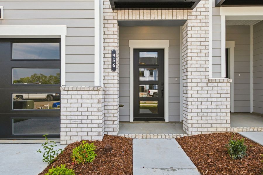 Exterior details and patio area of a home in Nexus Townhomes, Gallatin (Image 4).