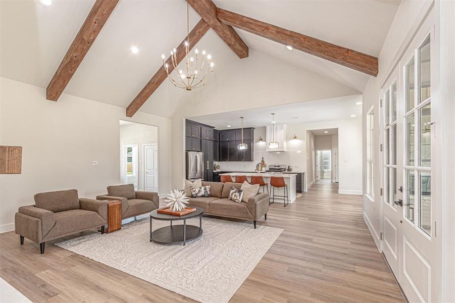 Vaulted ceiling featuring exposed wood beams