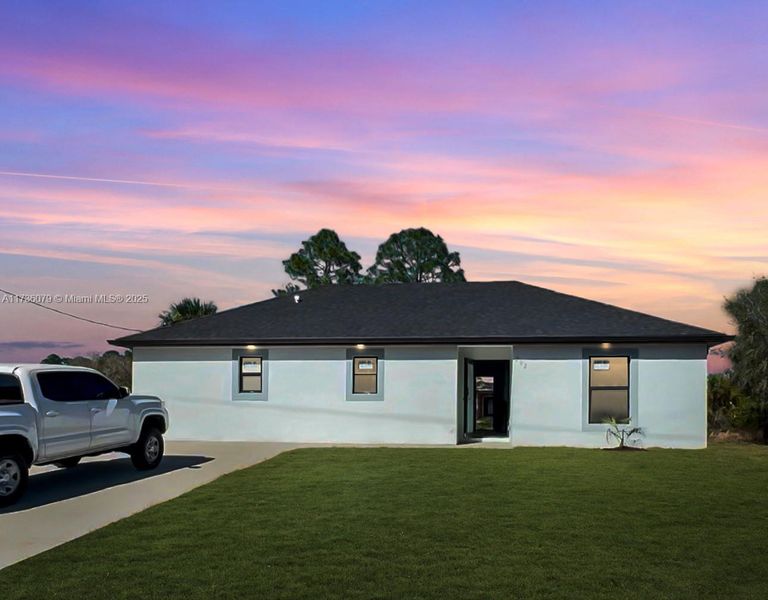 Front exterior of a new home in , Lehigh Acres, FL, highlighting curb appeal (Image 2). Front exterior of a new home in , Lehigh Acres, FL, highlighting curb appeal (Image 2).