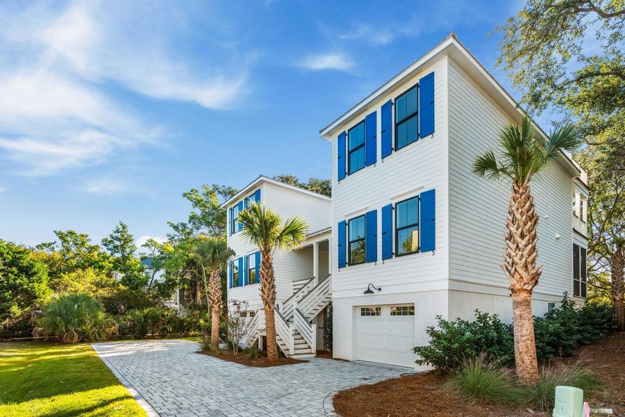 Front exterior of a new home in , Isle Of Palms, SC, highlighting curb appeal (Image 25).