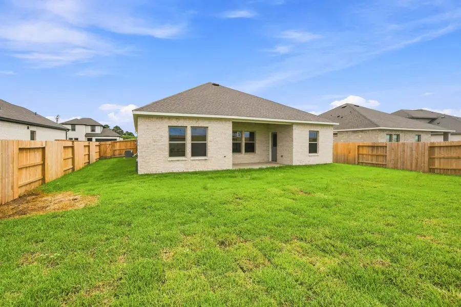 Exterior details and patio area of a home in Windcress, Cove (Image 3).