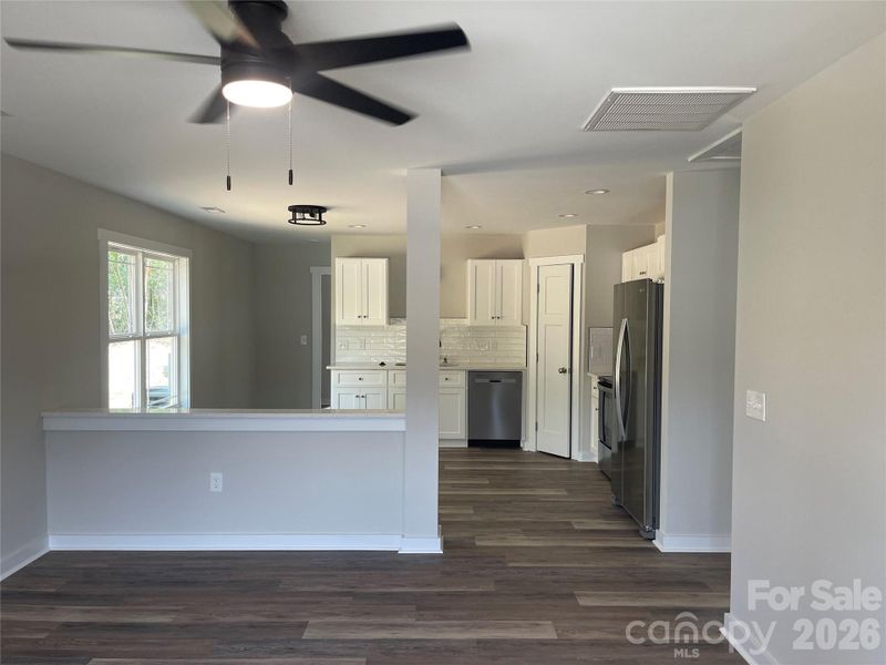 living room open to kitchen/eating area