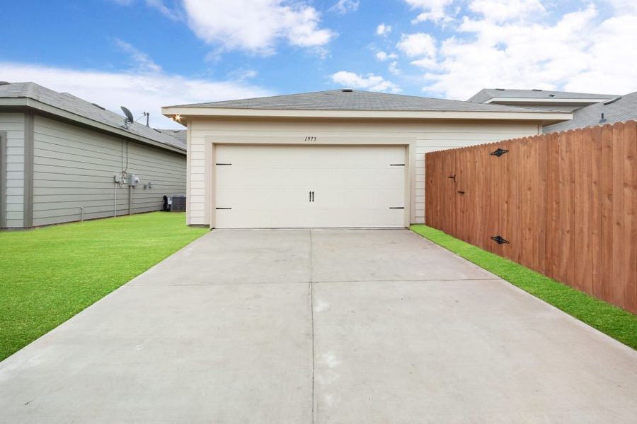 Representative exterior photo of a completed home built from the Harwood by Impression Homes in Heartland, Heartland, TX (Image 27).