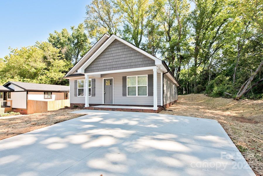 Front exterior of a new home in , Concord, NC, highlighting curb appeal (Image 16). Front exterior of a new home in , Concord, NC, highlighting curb appeal (Image 16).
