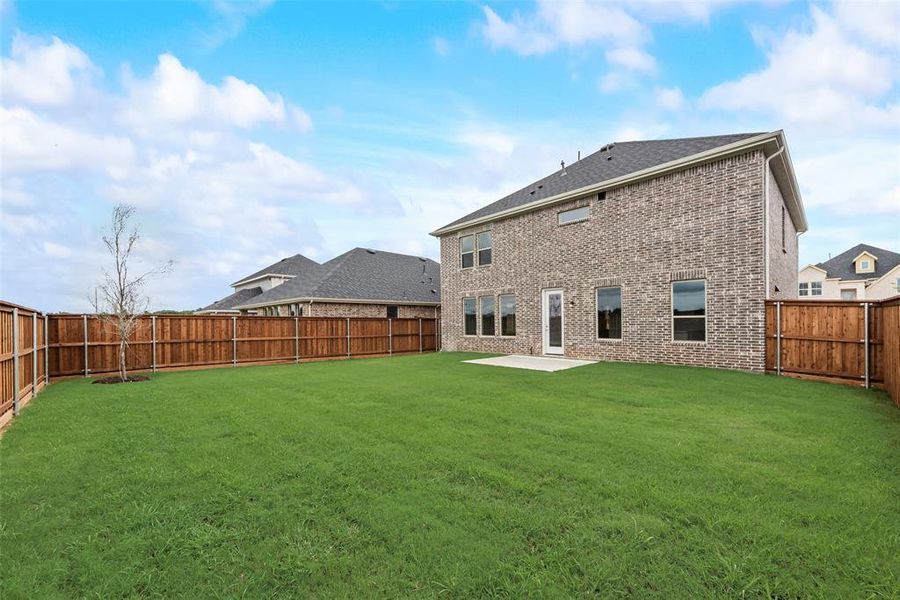 Front exterior of a new home in Spiritas Ranch, Little Elm, TX, highlighting curb appeal (Image 15). Front exterior of a new home in Spiritas Ranch, Little Elm, TX, highlighting curb appeal (Image 15).