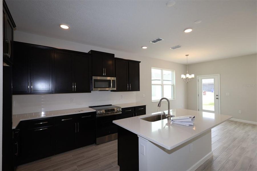 Furnished interior view inside a new home in Center Lake on the Park, St. Cloud (Image 7).