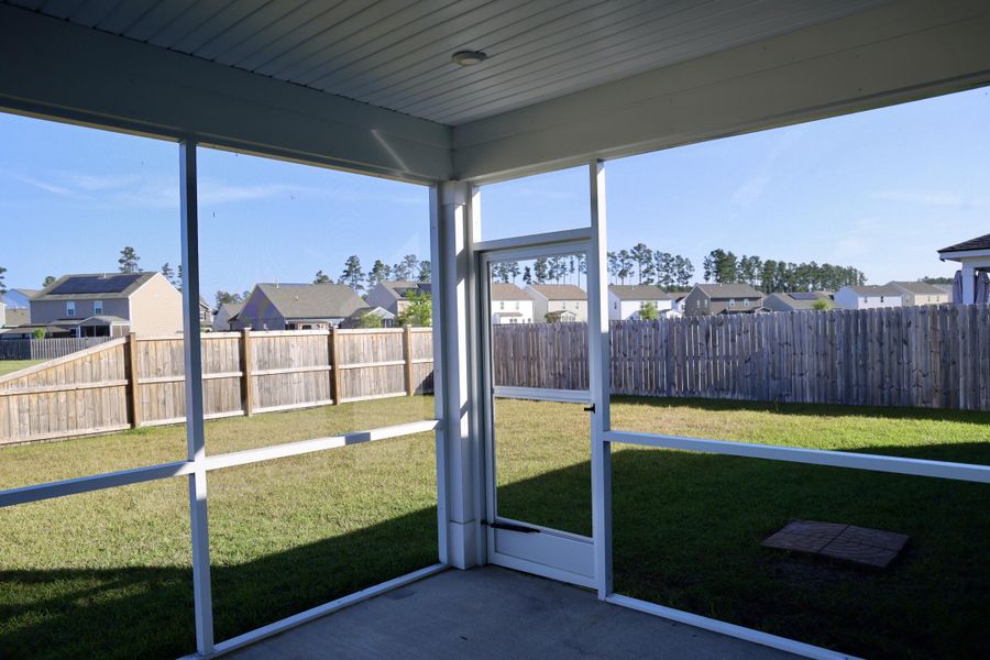 Exterior details and patio area of a home in Sanctuary Cove at Cane Bay, Summerville (Image 23).