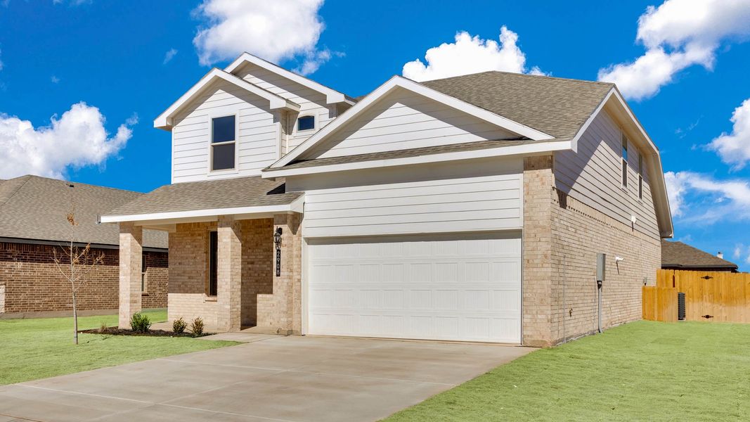 Front exterior of a new home in Viridian, Lubbock, TX, highlighting curb appeal (Image 23).
