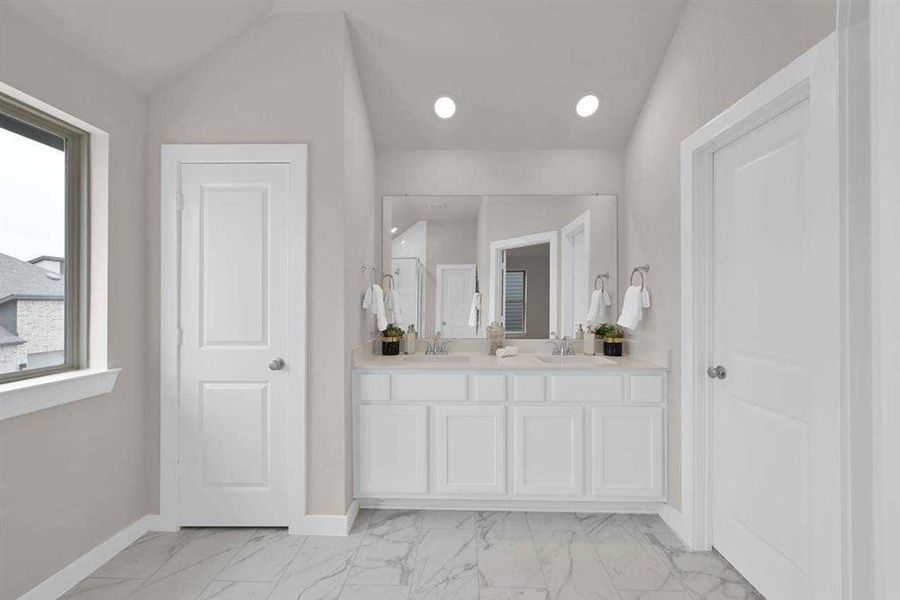 Spa-like ensuite with quartz counters and dual sinks. (Original Builder Staged Photo 2024)
