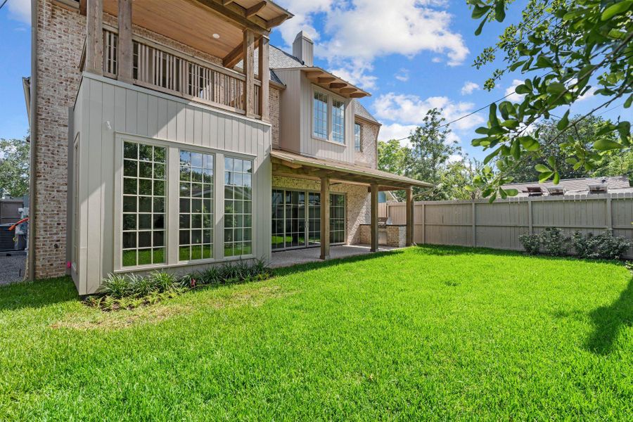 Oversized yard with room for a pool. Also, note the stained wood ceilings on all patios, soft painted pop outs and walls of pella aluminum clad windows that add dimension to the rear elevation. Oversized yard with room for a pool. Also, note the stained wood ceilings on all patios, soft painted pop outs and walls of pella aluminum clad windows that add dimension to the rear elevation.