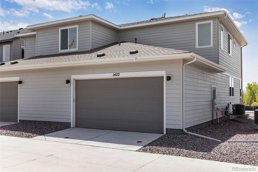Front exterior of a new home in Sugar Mill Village, Longmont, CO, highlighting curb appeal (Image 17).