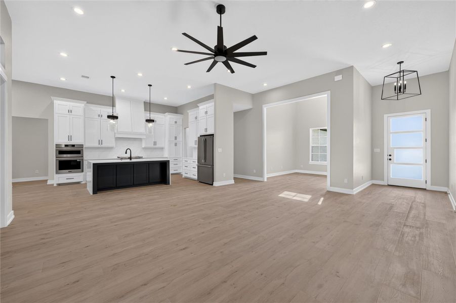 An open floorplan integrates the spacious living area with a modern kitchen.