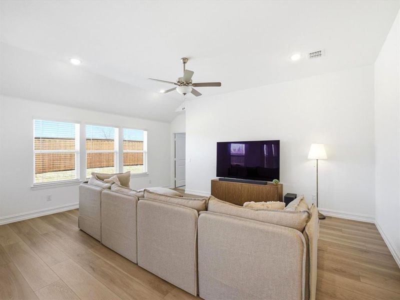 Living room view of single story three bedroom home with an office and a formal dining room