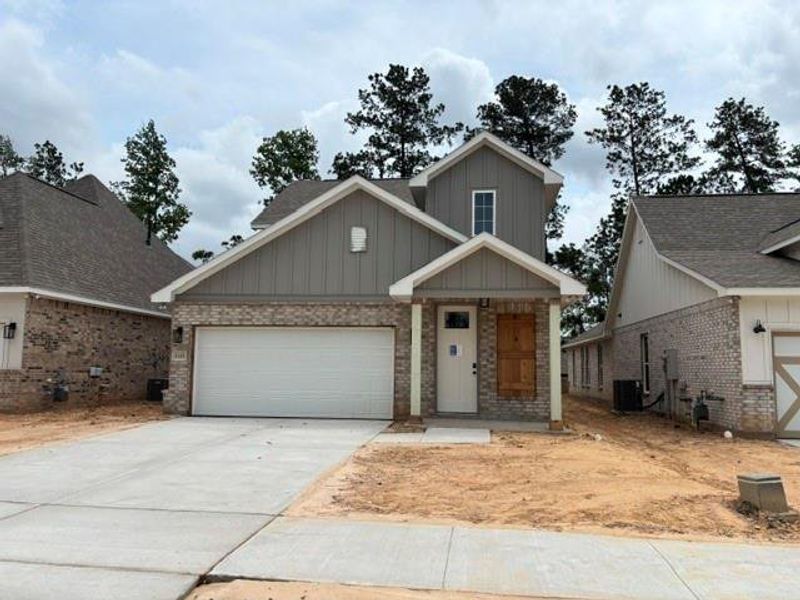 Front exterior of a new home in Two Step Farm, Montgomery, TX, highlighting curb appeal (Image 1). Front exterior of a new home in Two Step Farm, Montgomery, TX, highlighting curb appeal (Image 1).
