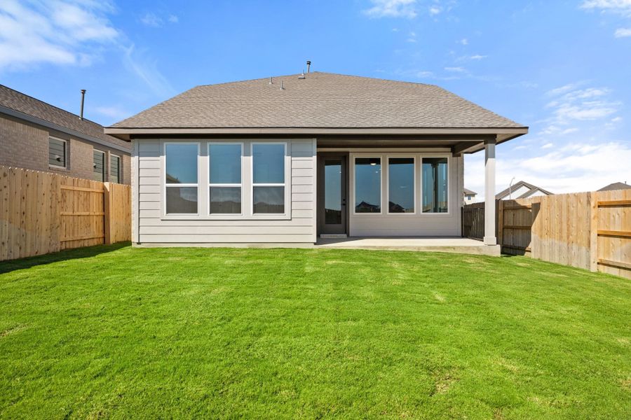 Exterior details and patio area of a home in Lariat, Liberty Hill (Image 28).