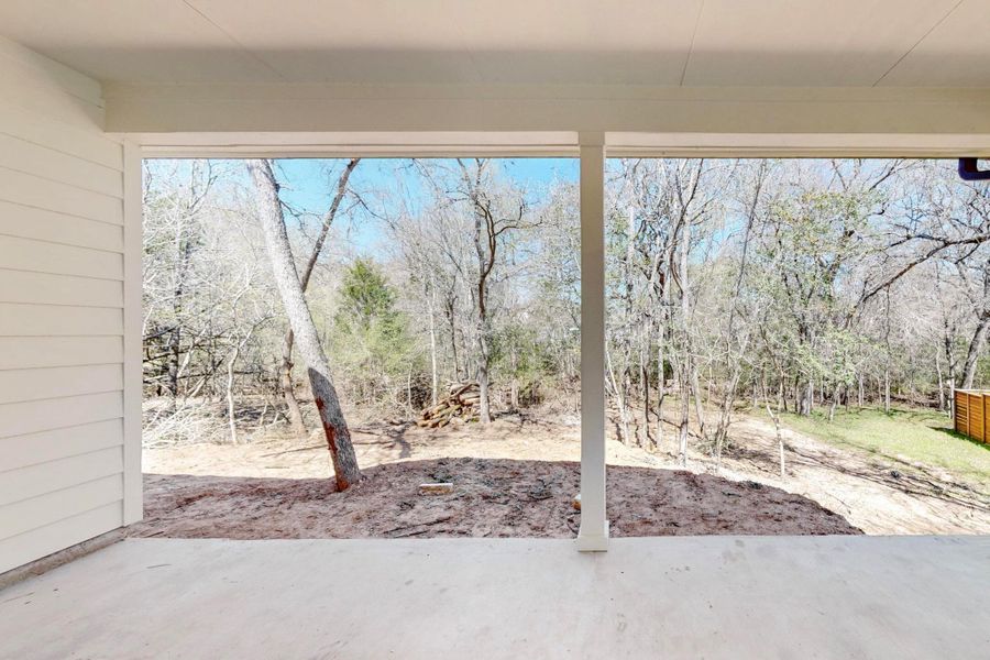 View of yard with a patio area and view of scattered trees