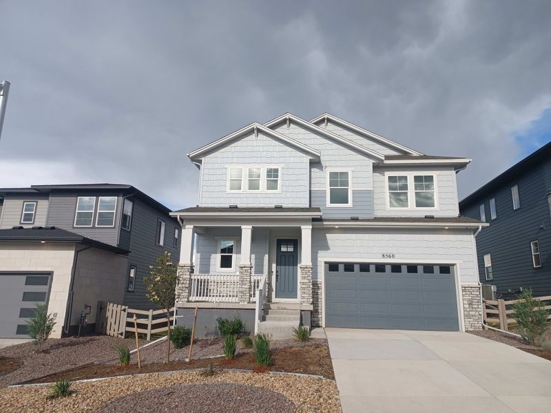 Front exterior of a new home in Sterling Ranch, Littleton, CO, highlighting curb appeal (Image 1). Front exterior of a new home in Sterling Ranch, Littleton, CO, highlighting curb appeal (Image 1).