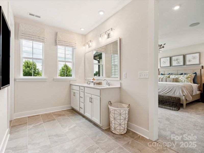 Dual vanity at en suite bath with loads of storage. *Model Photos | Actual finishes, structural selections, and orientation may vary.