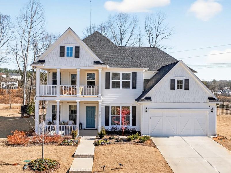 Front exterior of a new home in Reunion, Flowery Branch, GA, highlighting curb appeal (Image 2).