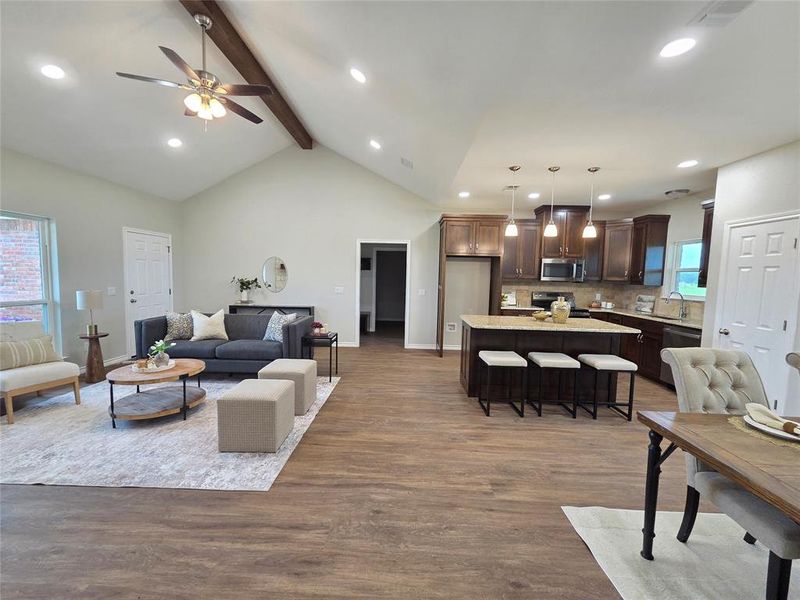Living room with wood finished floors, recessed lighting, and ceiling fan Living room with wood finished floors, recessed lighting, and ceiling fan