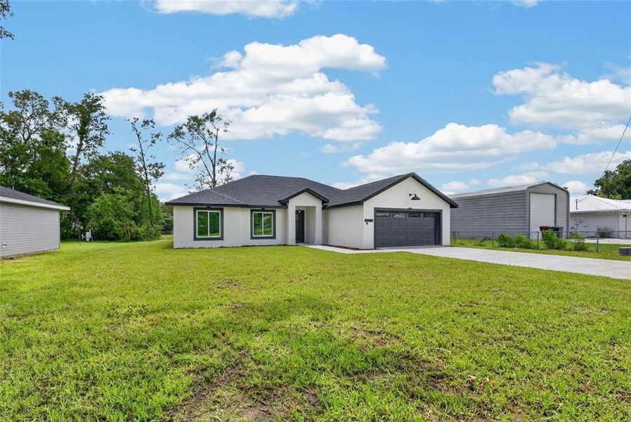 Front exterior of a new home in , Summerfield, FL, highlighting curb appeal (Image 25). Front exterior of a new home in , Summerfield, FL, highlighting curb appeal (Image 25).