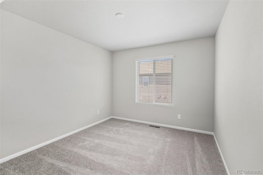 Spacious, unfurnished interior of a new home in Woodrose at Painted Prairie, Aurora (Image 26).