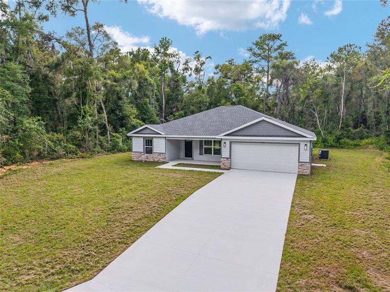 Front exterior of a new home in , Dunnellon, FL, highlighting curb appeal (Image 19).