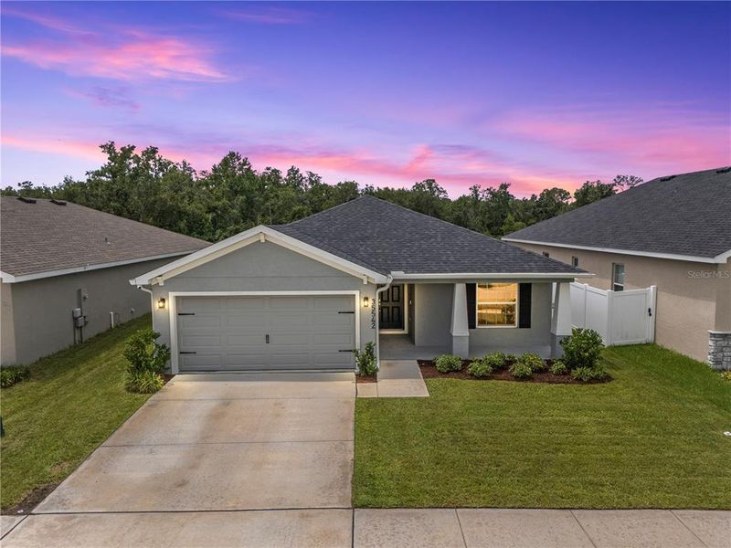 Front exterior of a new home in Stonebridge North, Zephyrhills, FL, highlighting curb appeal (Image 1). Front exterior of a new home in Stonebridge North, Zephyrhills, FL, highlighting curb appeal (Image 1).