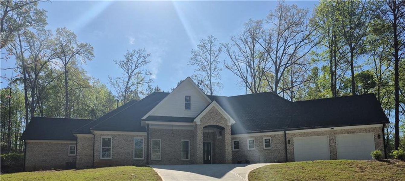 Front exterior of a new home in , Gainesville, GA, highlighting curb appeal (Image 2). Front exterior of a new home in , Gainesville, GA, highlighting curb appeal (Image 2).