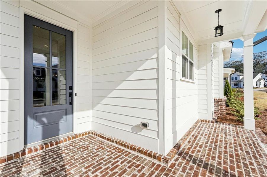 Exterior details and patio area of a home in Promenade at Sawnee Village, Cumming (Image 31). Exterior details and patio area of a home in Promenade at Sawnee Village, Cumming (Image 31).