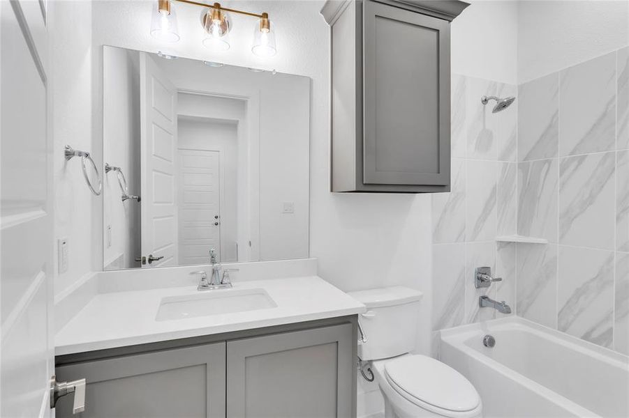 Full bathroom featuring washtub / shower combination and vanity