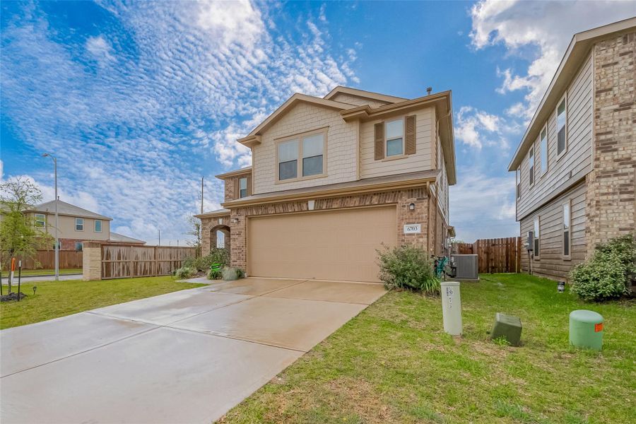 Front exterior of a new home in Deer Run Meadows, Richmond, TX, highlighting curb appeal (Image 2). Front exterior of a new home in Deer Run Meadows, Richmond, TX, highlighting curb appeal (Image 2).
